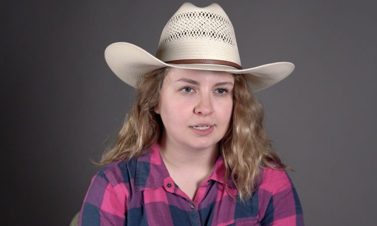 woman with long hair in a cowboy hat