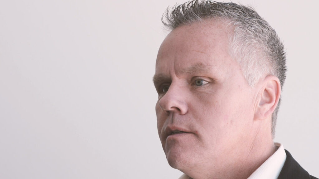 man with short gray hair