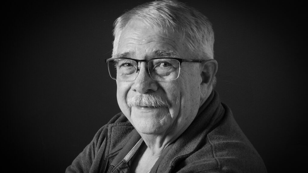 older man with glasses and mustache