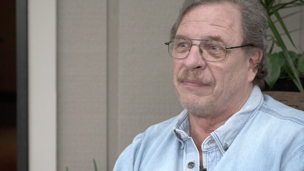 man in denim shirt