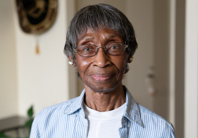 Hitting Home storyteller older woman with glasses and gentle smile