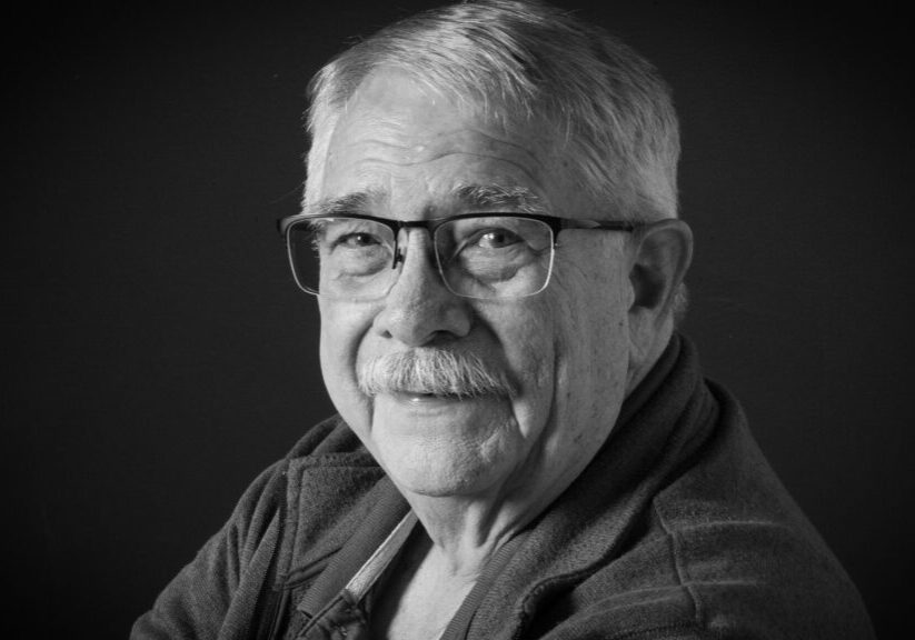 older man with glasses and mustache