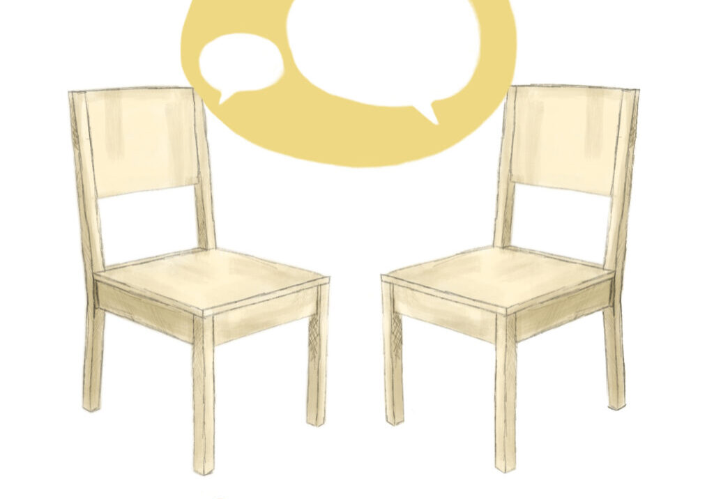 two yellow wooden chairs talking to each other
