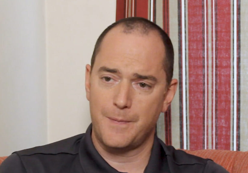 man with short cropped hair